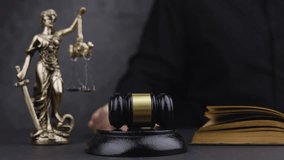 Judge with paper document pronouncing sentence in a court of law. Judge finds the accused guilty, passes judgement and rules case closed. Hand holding gavel and hitting sound block in close-up - Powered by Shutterstock - Get 15% off with code: PIKWIZARD15