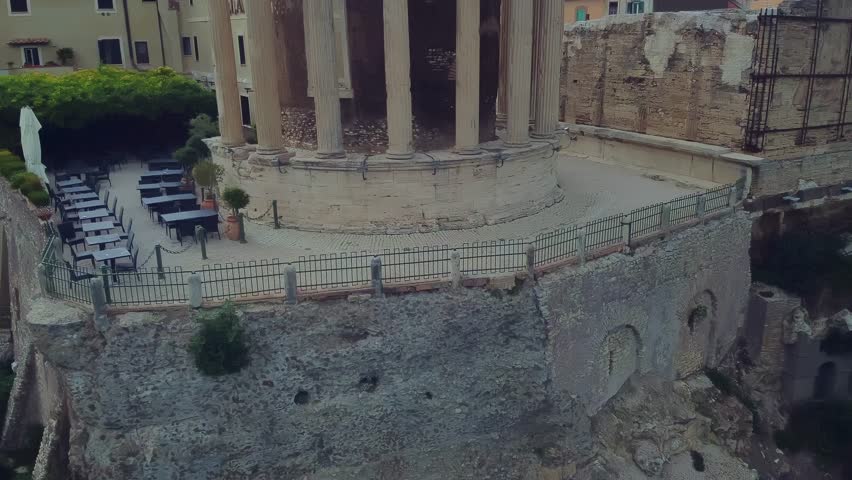 Capture a unique spot for relaxation in Tivoli, set against the backdrop of a historical monument, blending serene natural beauty with rich cultural heritage