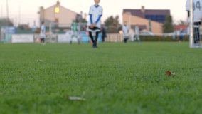 bokeh effect teen workout Young players practice soccer energetically on a vibrant green field, with buildings in the background - Powered by Shutterstock - Get 15% off with code: PIKWIZARD15