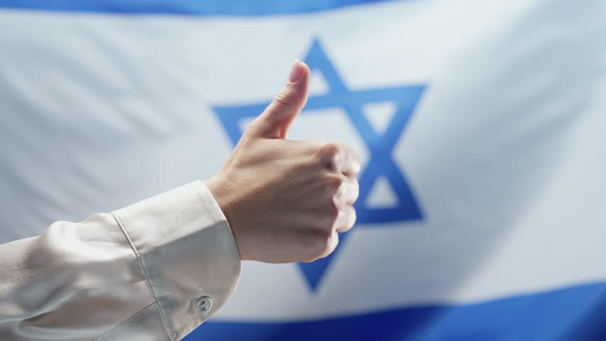 Jew Woman Makes Hand Sign Like, Thumb Up Gesture on israeli flag background. Israel, Correct Perfect Choice, Great Deal. Positive, approval, trust concept.