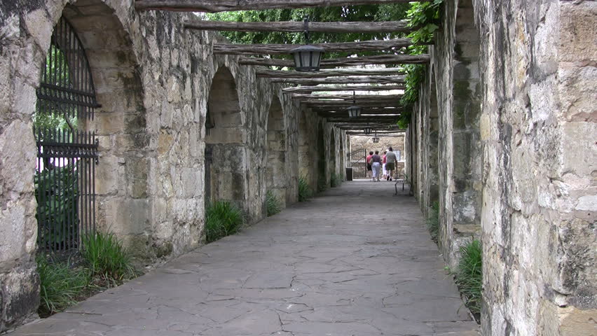 Video of arch walkway of the Alamo shrine in San Antonio Texas. Stone columns and vin covered arch. Historic famous building Texas independence battle with Mexico. Don Despain of Rekindle Photo
