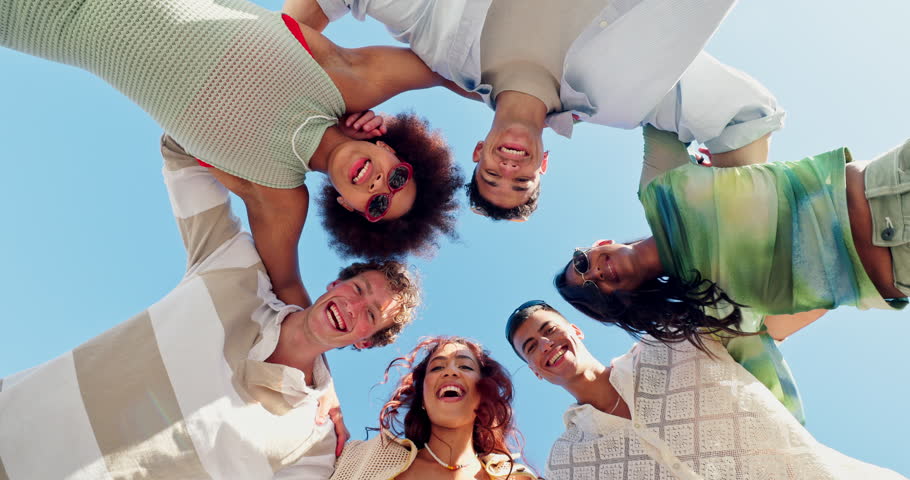 Face, smile and huddle with low angle of people for community, trust and connection. Diversity, helping others and solidarity with group of friends in nature for teamwork, circle and partner