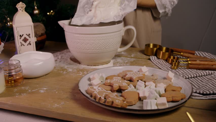 Young baker places large block of butter in mixing bowl in order to combine ingredients for their Christmas baking and ginger cookies. - Powered by Shutterstock - Get 15% off with code: PIKWIZARD15