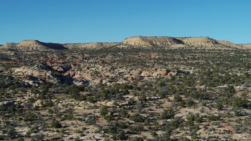 Aerial of San Rafael Swell in Central Utah with canyon landscape with mesas and rock formations