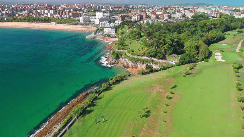 Golf course at Cabo Menor in Santander, Cantabria, northern Spain. Aerial view of the stunning golf fields on the peninsula, featuring rocky cliffs and scenic views of Santander city.