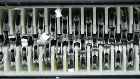 Close up view of Shredder Cutting Paper. View From Below,  - Powered by Shutterstock - Get 15% off with code: PIKWIZARD15