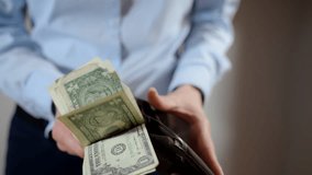 Woman opens red wallet and takes out money - Powered by Shutterstock - Get 15% off with code: PIKWIZARD15