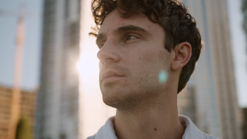 Close up face serious Caucasian man looking away male pondering confident businessman difficult decision think problem boss work employee expression business outdoors guy manager city student consider