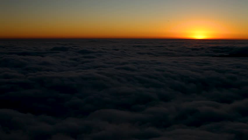 A sunrise time-lapse refers to a video or sequence of photos that captures the gradual transition from night to day, showing the rising of the sun over a landscape.