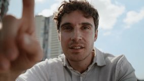 Focused Caucasian man scrolling swipe virtual touch screen artificial intelligence AR male guy businessman technology network fingers zoom influencer blogger modern user city outdoor business smiling - Powered by Shutterstock - Get 15% off with code: PIKWIZARD15