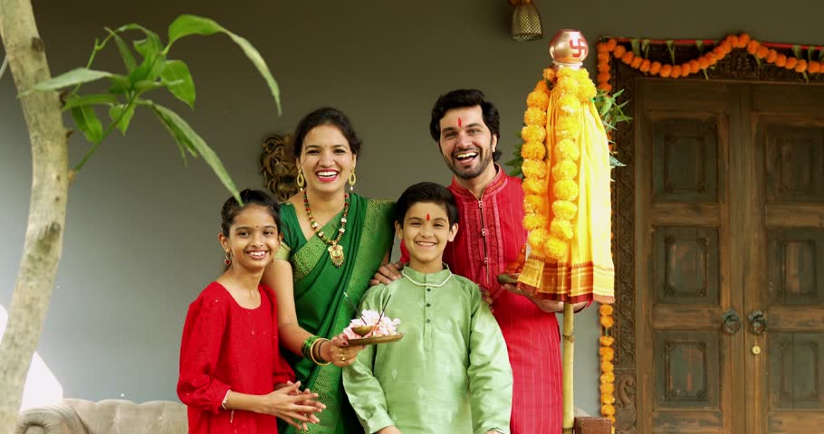 Portrait of Happy Indian Family in Traditional Attire Smiling After Gudi Padwa Puja Outdoors, Celebrating Hindu New Year with Kids