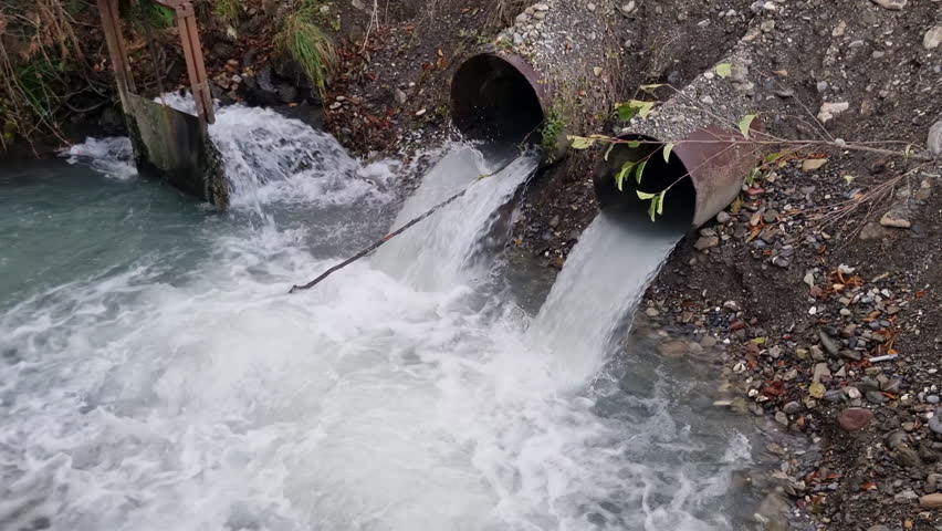 Dirty Sewage Spewing from a Pipes, Exposing the Environmental Impact of Human Activities