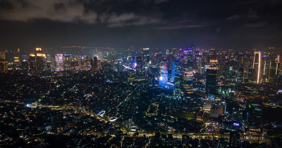 Aerial timelapse of Jakarta city skyline at night, Indonesia