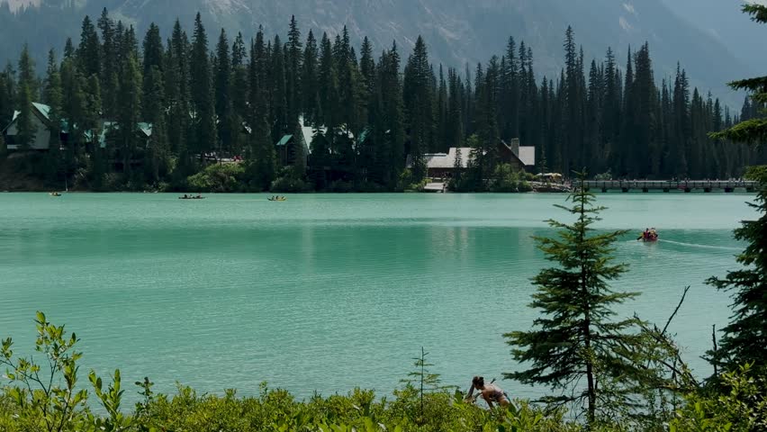 Emerald Lake is located in Yoho National Park in Canada. Famous for its emerald color and the splendid view of the Canadian Rockies that frame it. Canoe excursion with family. Trekking to the lake.
