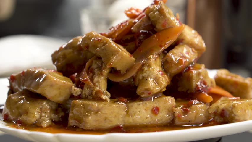 Kung Pao Tofu With Vegetables on a wooden background. Food concept. Chinese food.