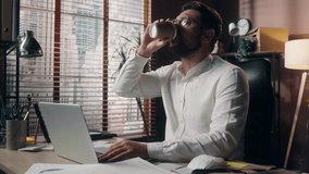 Tired Caucasian guy executive worker sleepy leader yawning working online exhausted trader man businessman male agent using laptop app in office tiredness overworked employer drinking coffee business - Powered by Shutterstock - Get 15% off with code: PIKWIZARD15