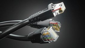 Internet network connectors rj45 and ethernet cables on black background. 3d animation. 3D Illustration - Powered by Shutterstock - Get 15% off with code: PIKWIZARD15