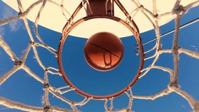 Slow Motion Captures The Basketball's Trajectory As It Enters The Basket. The Hoop And Net React Dynamically, Displaying The Precision Of This Perfect Goal. - Powered by Shutterstock - Get 15% off with code: PIKWIZARD15