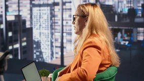 Determined businesswoman speaking on a phone call to ensure project development success, multitasking in a corporate office. Female CEO using remote connection on her smartphone. Camera A. - Powered by Shutterstock - Get 15% off with code: PIKWIZARD15