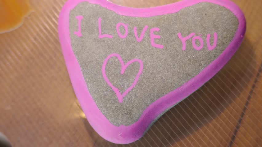 I love you message painted on heart shaped rock