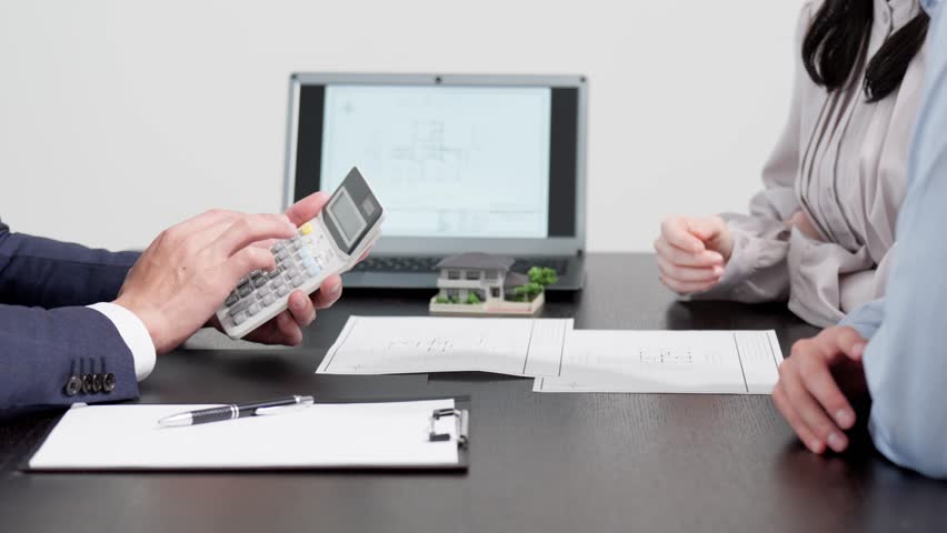 Businessman calculating real estate quote