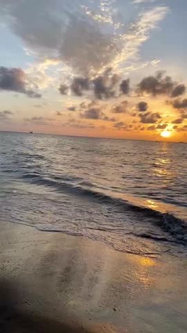 Capturing the serene scene of a calm beach during sunset. Perfect landscape background and summer holiday concept