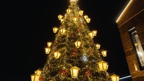 A Stunningly Beautiful Christmas Tree is Illuminated at Night, Captured in Crisp 4K Resolution for All to Enjoy - Powered by Shutterstock - Get 15% off with code: PIKWIZARD15