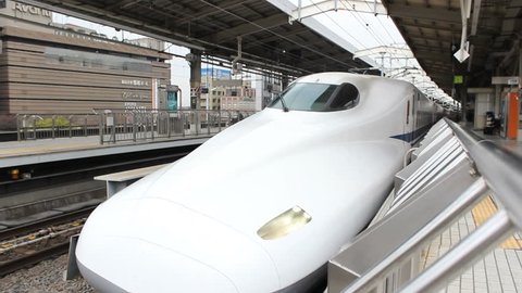 KYOTO - CIRCA MARCH 2013: A Shinkansen (Bullet Train) departs Kyoto Station Kyoto, Japan circa March 2013.