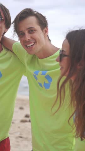 Volunteers gather on a beautiful beach to clean up litter and promote environmental awareness. The team passionately works to restore the shoreline while enjoying the sunshine and camaraderie.