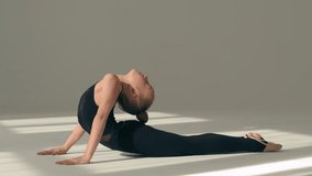 Little girl teen kid child Caucasian daughter schoolgirl ballerina acrobat dancer gymnast female sportswoman training dance class workout exercise back bending pose flexible body stretching ballet - Powered by Shutterstock - Get 15% off with code: PIKWIZARD15