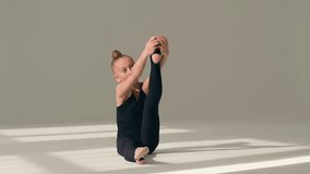 Female gymnast little girl child acrobat dancer kid daughter teen schoolgirl sportswoman athlete ballerina sport yoga stretching legs body flexibility gymnastics training exercise dance ballet studio - Powered by Shutterstock - Get 15% off with code: PIKWIZARD15