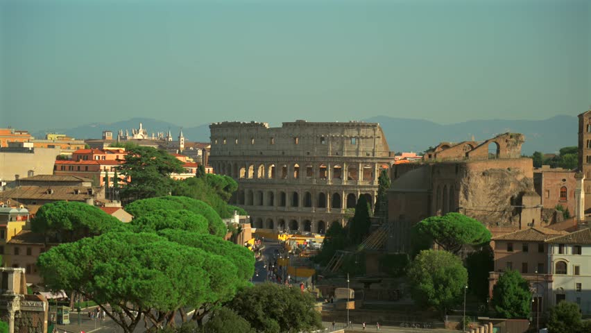 Overhead view of Rome city and coliseum from observation deck Atrio della liberta. Rome skyline and Colosseum from viewing point Piazza Venezia. Top view of Rome city with Colosseum and Roman Forum. 