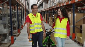 Warehouse workers walk and talk in slow motion along a spacious aisle, showcasing teamwork and collaboration in a bright environment - Powered by Shutterstock - Get 15% off with code: PIKWIZARD15