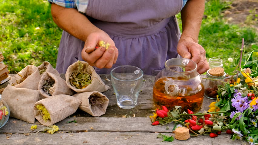 Woman with medicinal herbs. selective focus.