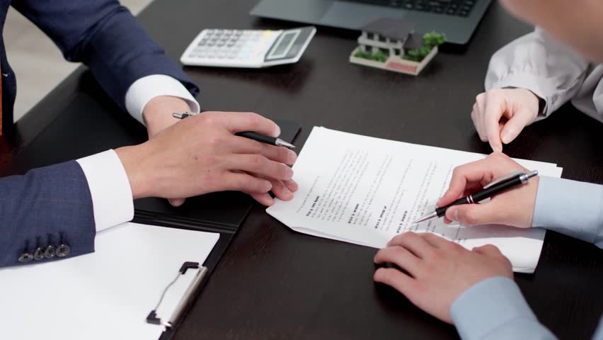 Man signing a real estate contract