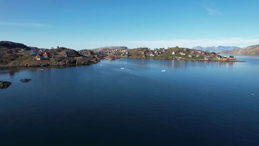A typical small Inuit village (settlement) in Greenland. Filmed during the summer on a sunny day.