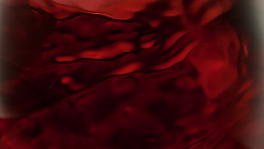 Super Slow Motion Macro Shot of Spinning Red Wine in Glass at 1000fps.