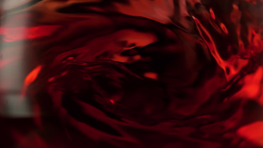 Super Slow Motion Macro Shot of Spinning Red Wine in Glass at 1000fps.