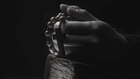 Hands folded in prayer on a Holy Bible in church. Woman praying with a wooden cross. Spirituality religion and hope concept. Supplication believe and faith. Abstract vintage religious dark background - Powered by Shutterstock - Get 15% off with code: PIKWIZARD15