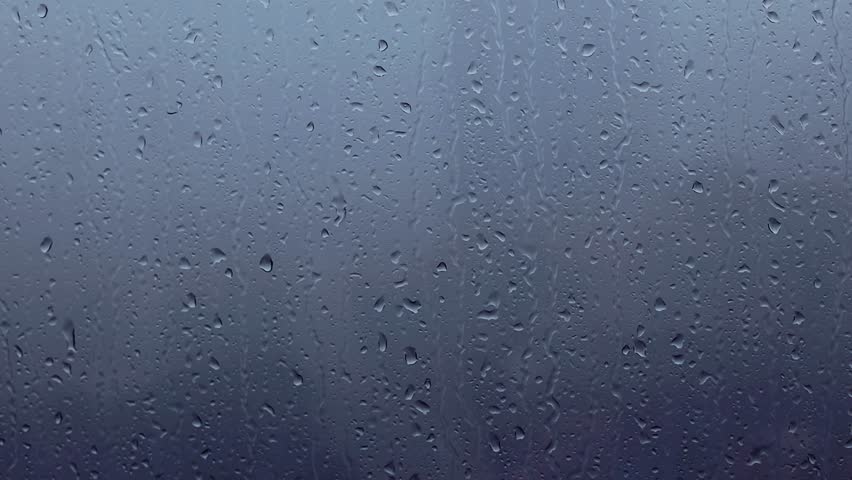 Rain drops on the window on rainy gloomy day