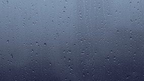 Rain drops on the window on rainy gloomy day - Powered by Shutterstock - Get 15% off with code: PIKWIZARD15