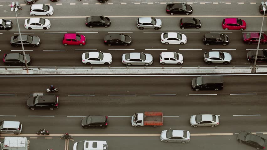 Aerial view of the traffic jam on the highway cars moving on the road in Kuala Lumpur, Malaysia