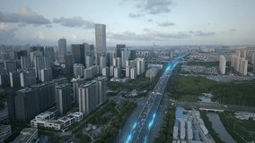 Aerial sunset cityscape of modern smart city with animation of lights trails on main highway fast internet optical fibre digital revolution technology concept - Powered by Shutterstock - Get 15% off with code: PIKWIZARD15