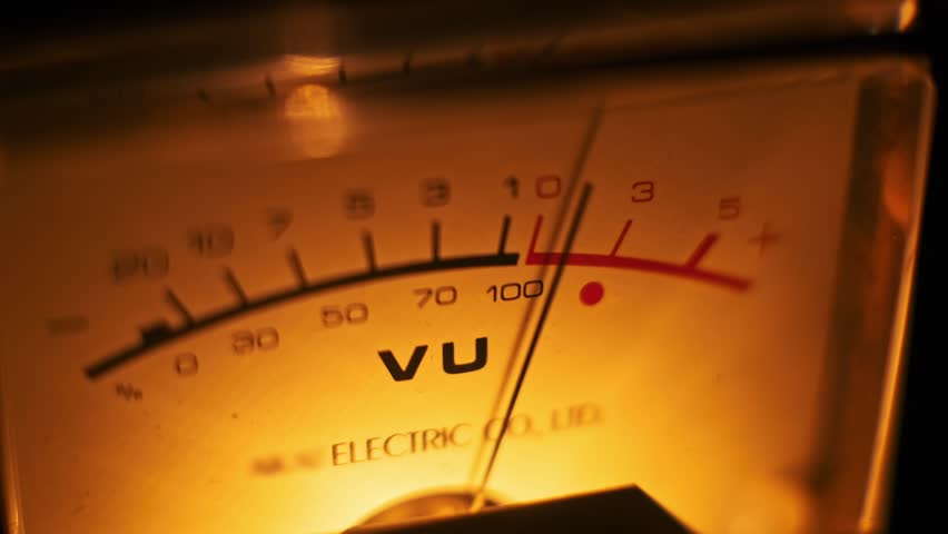 An analog VU meter glows warmly in the dark. The needle's movement creates a subtle animation. Great for vintage music videos.