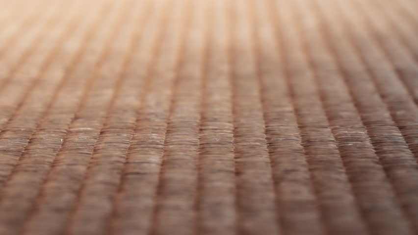 Close up of the traditional Japanese tatami mat on the floor of the house. Slow motion.