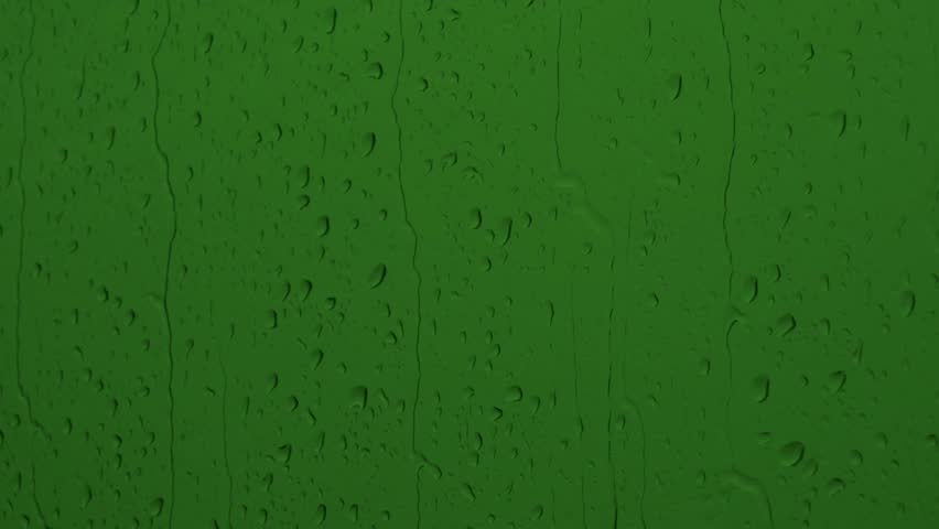 Closeup green screen rain video. Video editing element in VFX projects and overlays