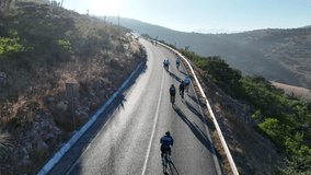 Dynamic Drone Aerial Footage of Cyclists Racing at High Speed on a Highway During a Gran Fondo Long Distance Race Event in San Luis Potosí, Mexico - Powered by Shutterstock - Get 15% off with code: PIKWIZARD15