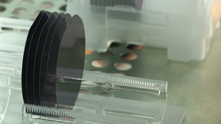 Detail view of silicon wafers being prepared to go into a kiln as part of a