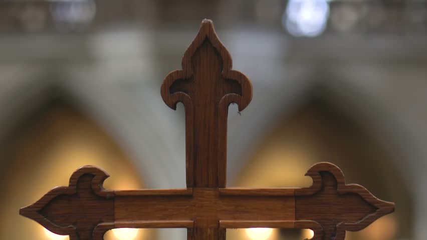 ROTHENBURG, GERMANY - NOVEMBER 24, 2023: Wooden cross in St.Jakobskirche Church interior in Rothenburg ob der Tauber, Bavaria state, Germany.
