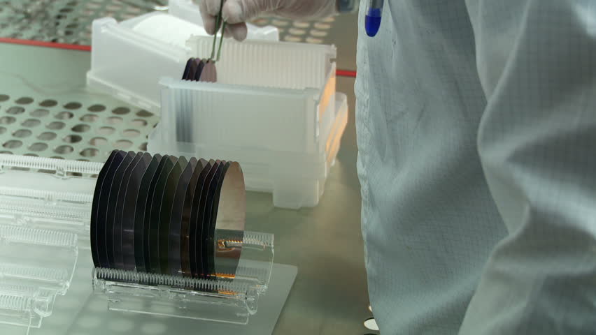 Close view of silicon wafers as they are prepared to go into a kiln as part of a